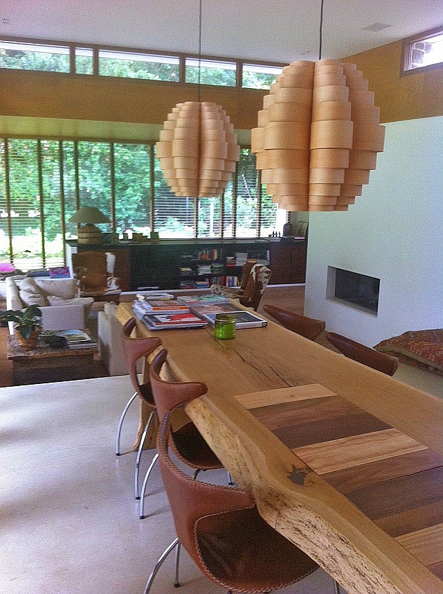 glow pendant light in ash wood above wooden table in living room